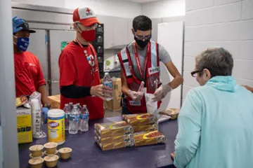 Individuals handing out food