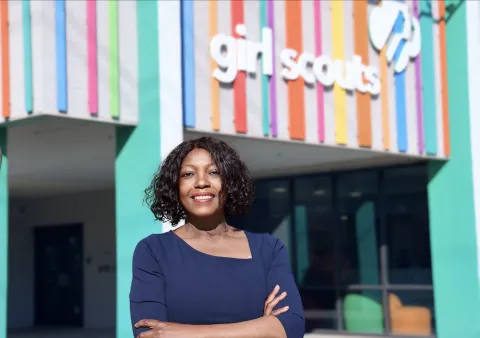 Sherri Jenkins in front of Girl Scouts building